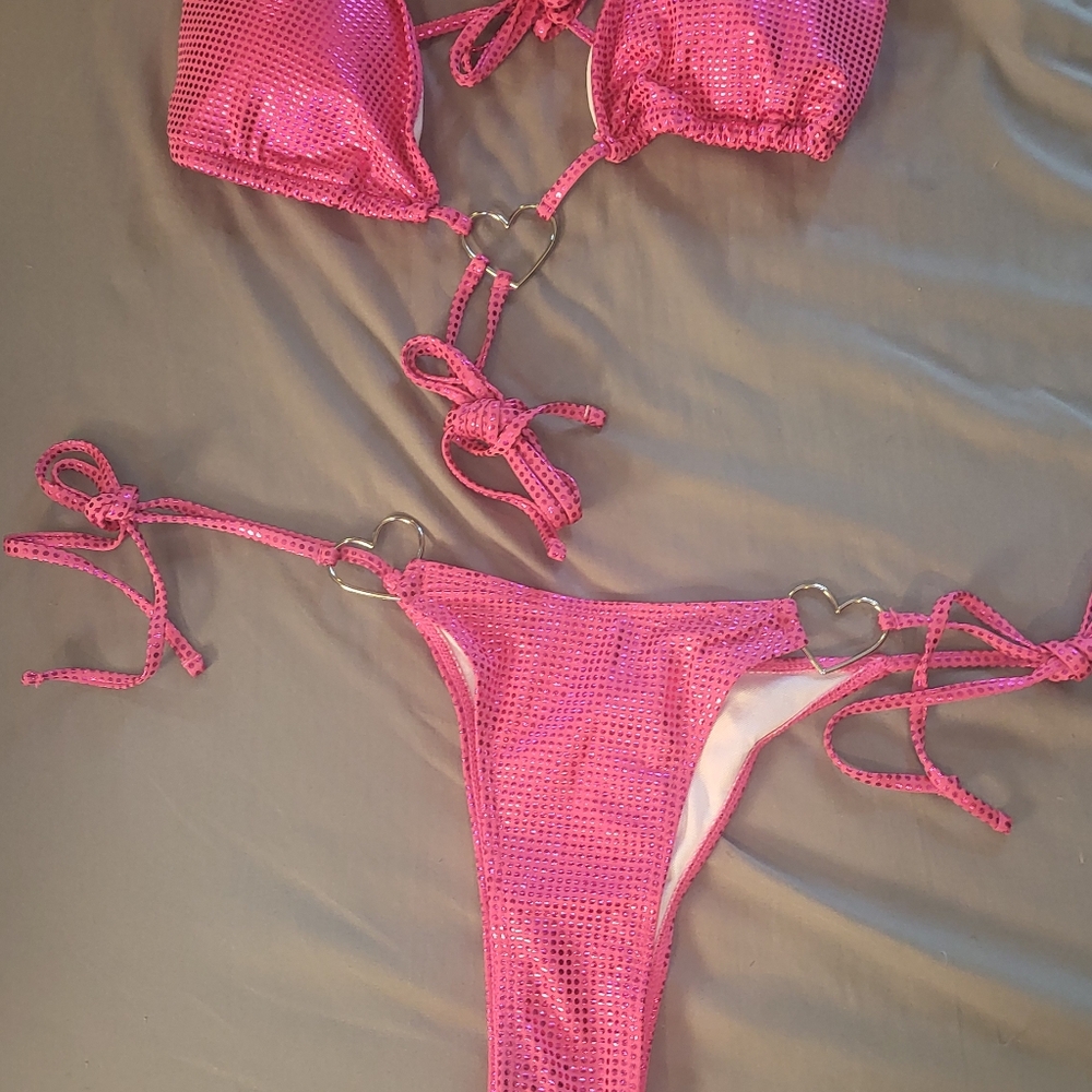 Pink bathing suits with silver heart decals